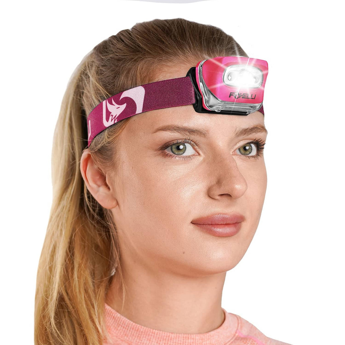 Neon pink LED headlamp with adjustable strap on a woman’s forehead