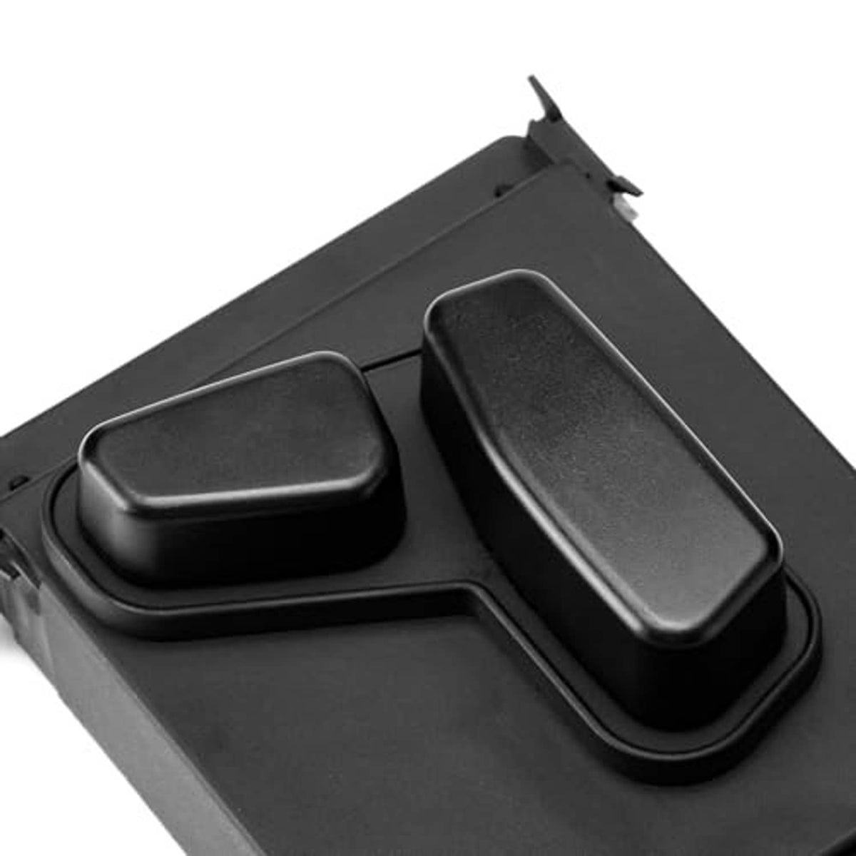 Close-up of power seat switch control with two textured rocker buttons
