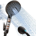 Oil-rubbed bronze handheld filtered showerhead with spray water stream