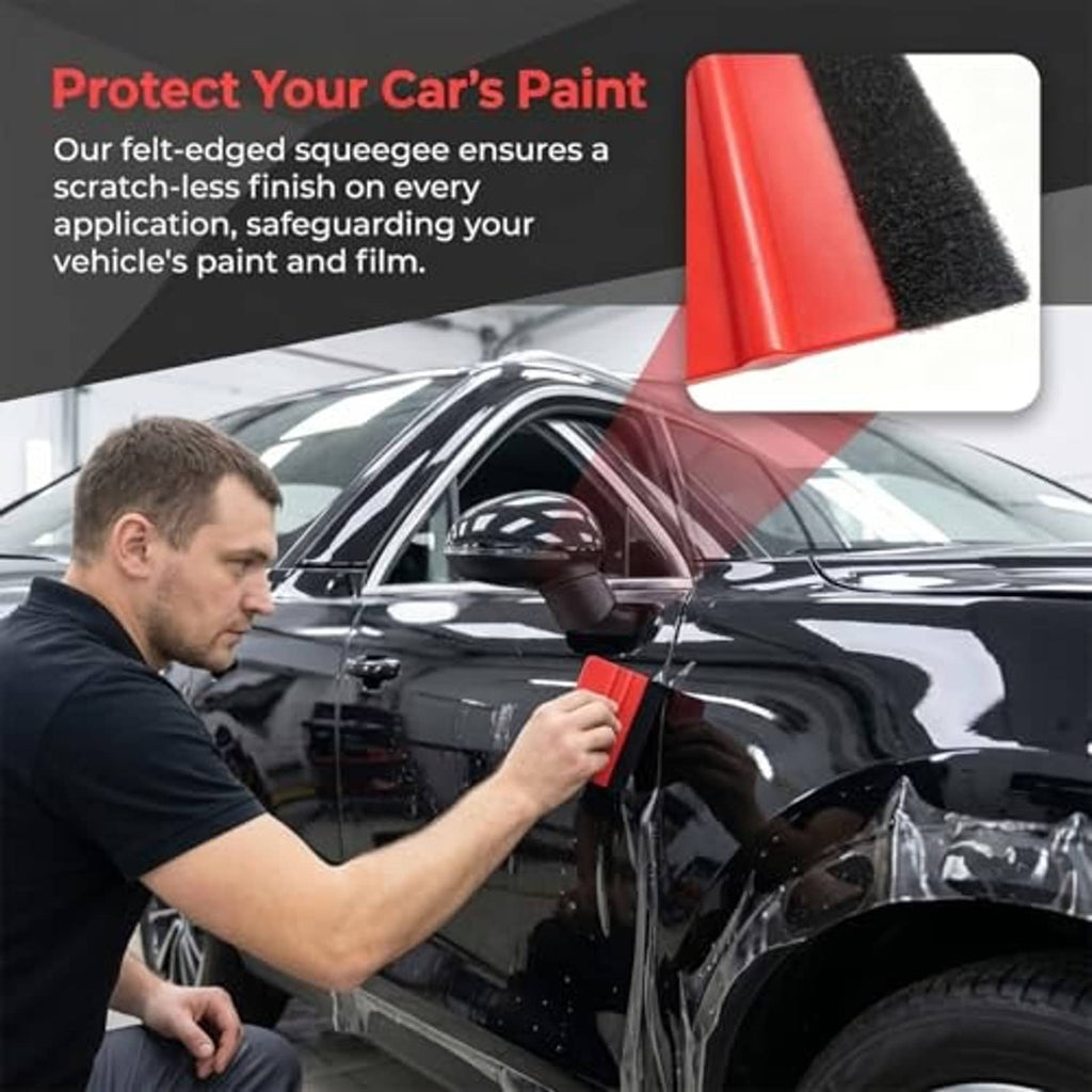 Red felt-edge squeegee tool held on a car surface for paint protection