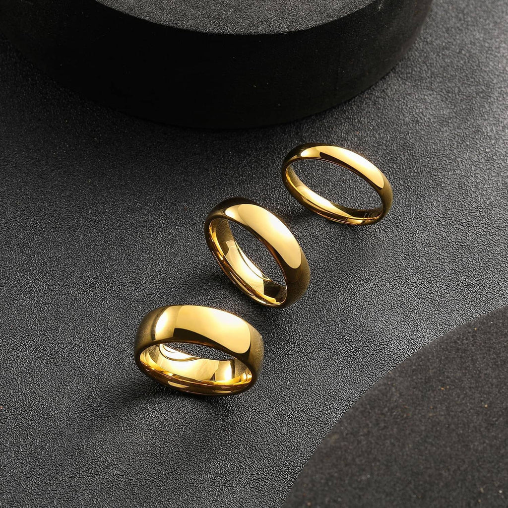 Three gold plated tungsten carbide rings, glossy finish, stacked for display