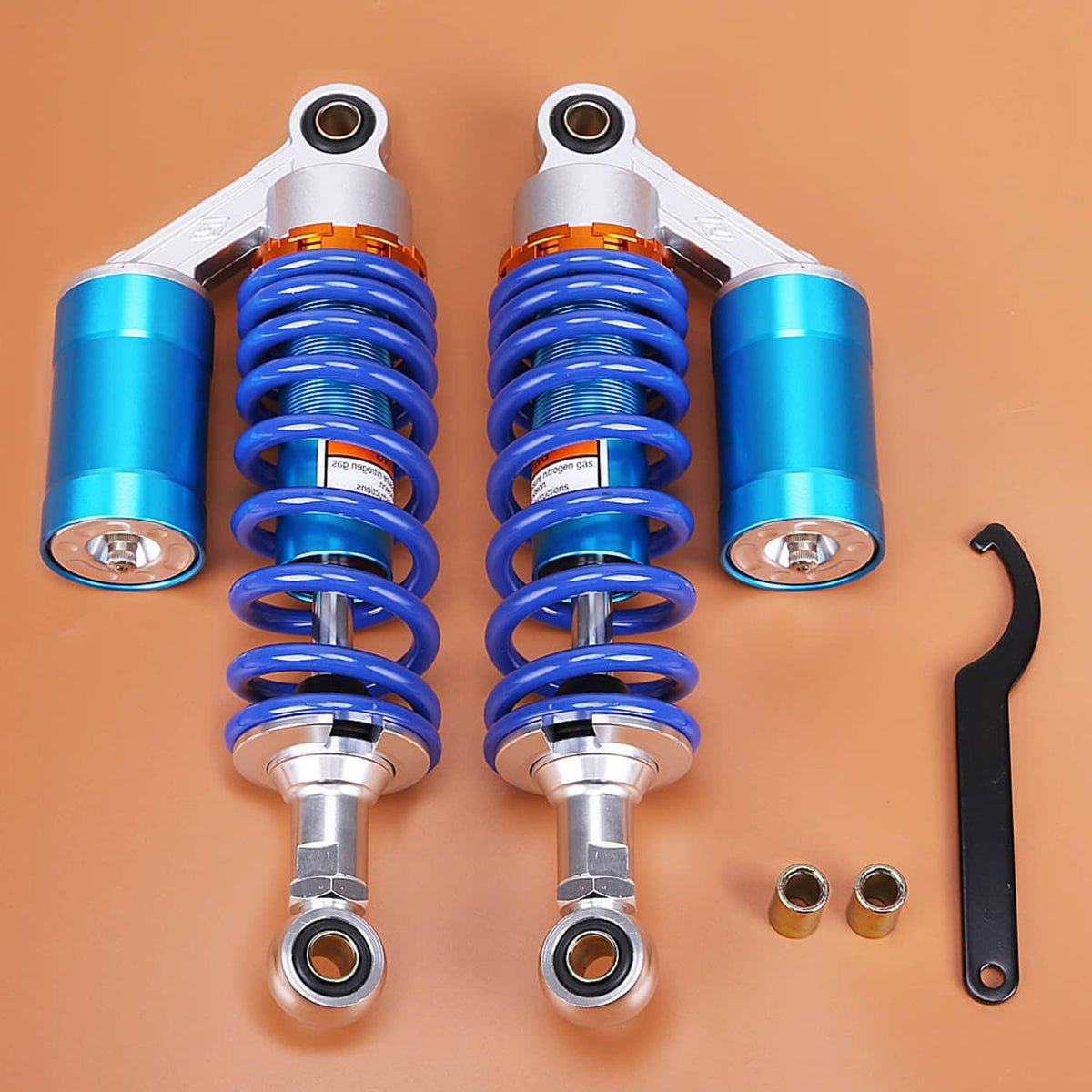 Motorcycle rear air shock absorbers with blue coil springs, silver bodies, and hardware
