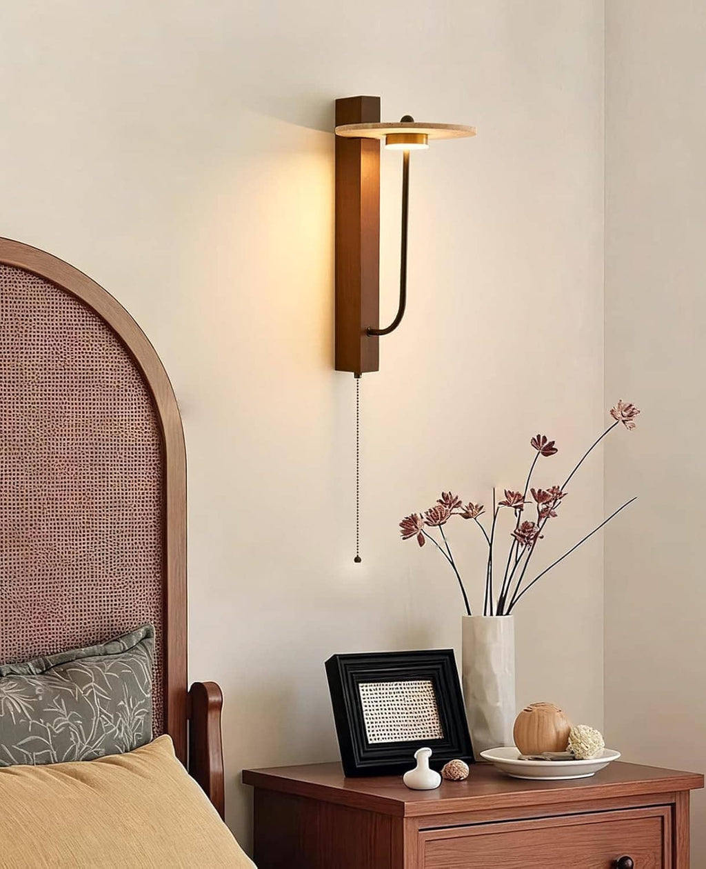 Tall wood wall sconce with round travertine shade and hanging pull cord