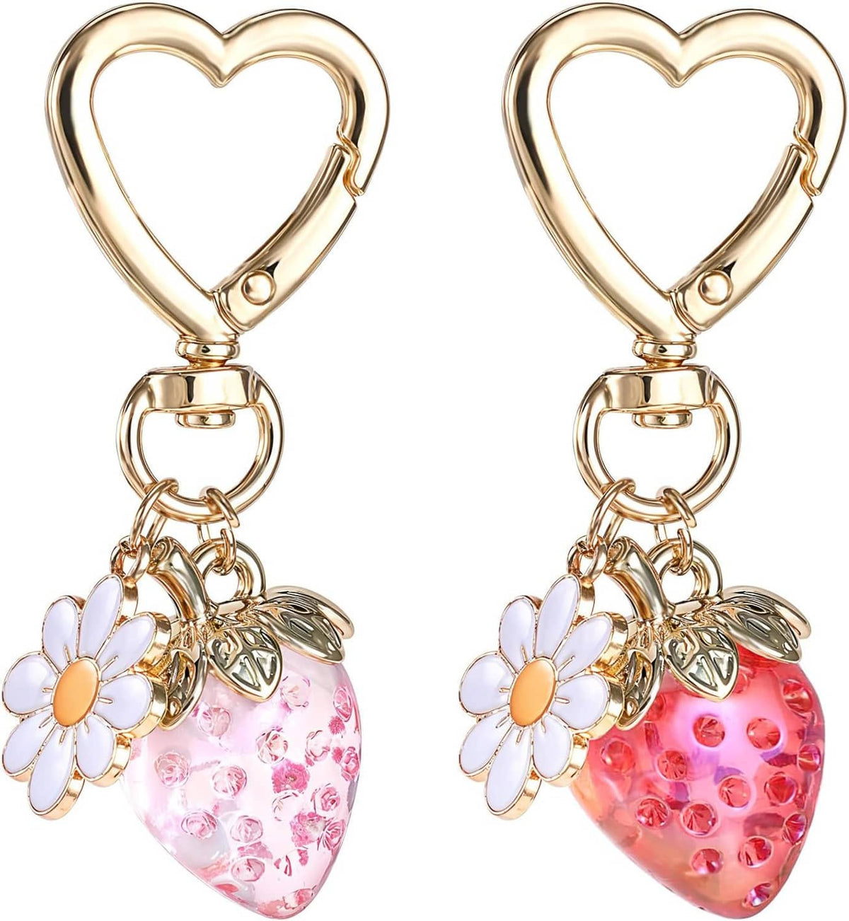 Gold heart keychain pair with daisy flowers and dangling pink and red strawberry charms