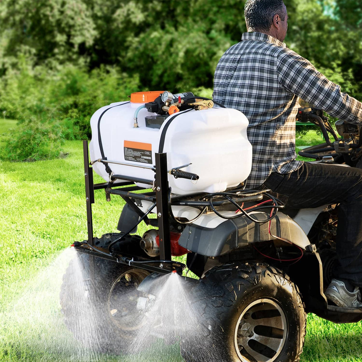 ATV spot sprayer spraying across grass with white tank and black boom