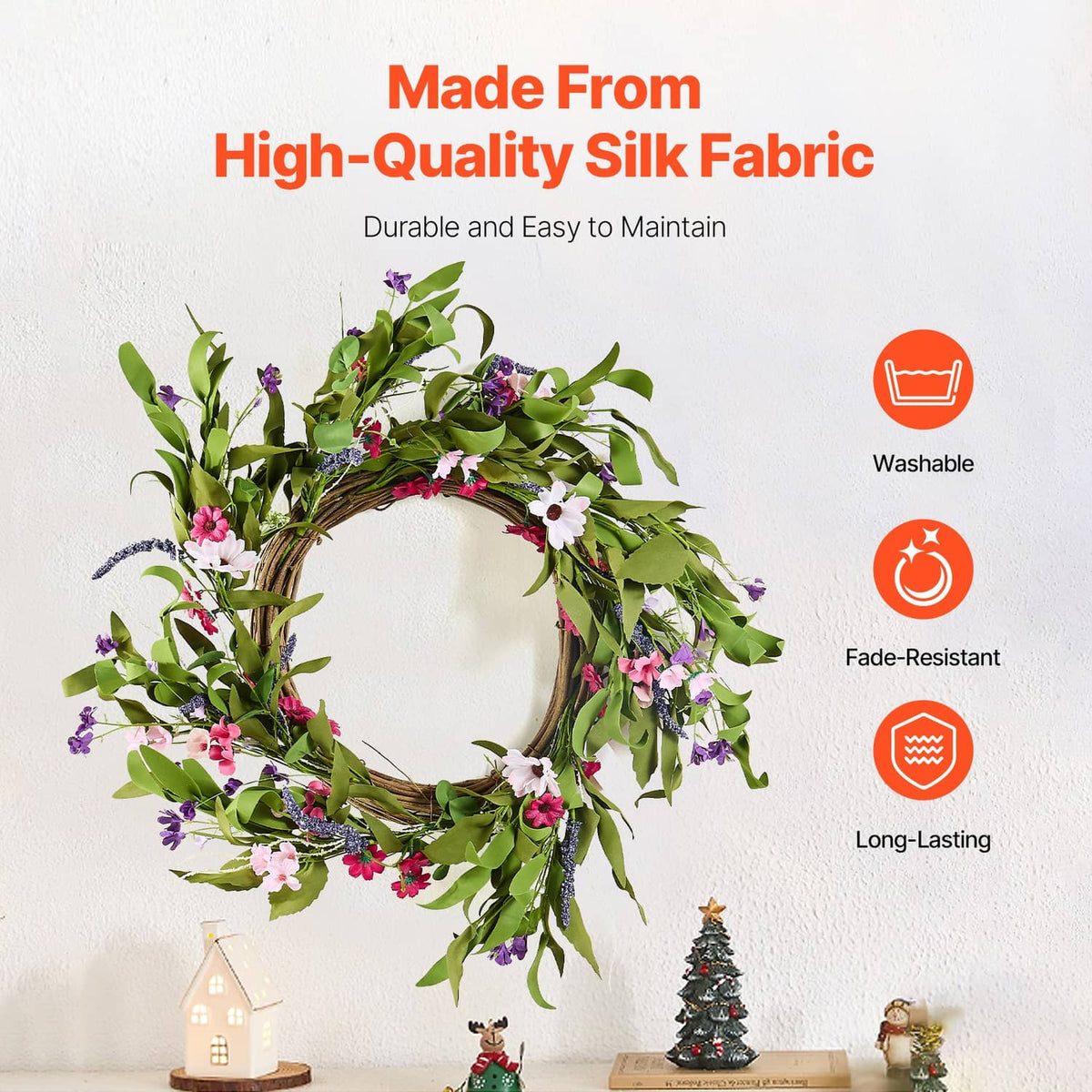 Silk-style artificial wreath with green leaves and pink, white, purple layered blooms
