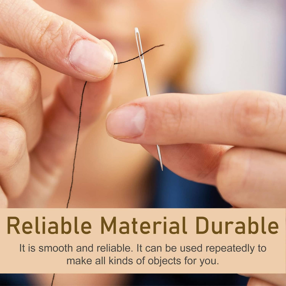 Hand-sewing with a large-eye needle, silvery metal needle and dark thread