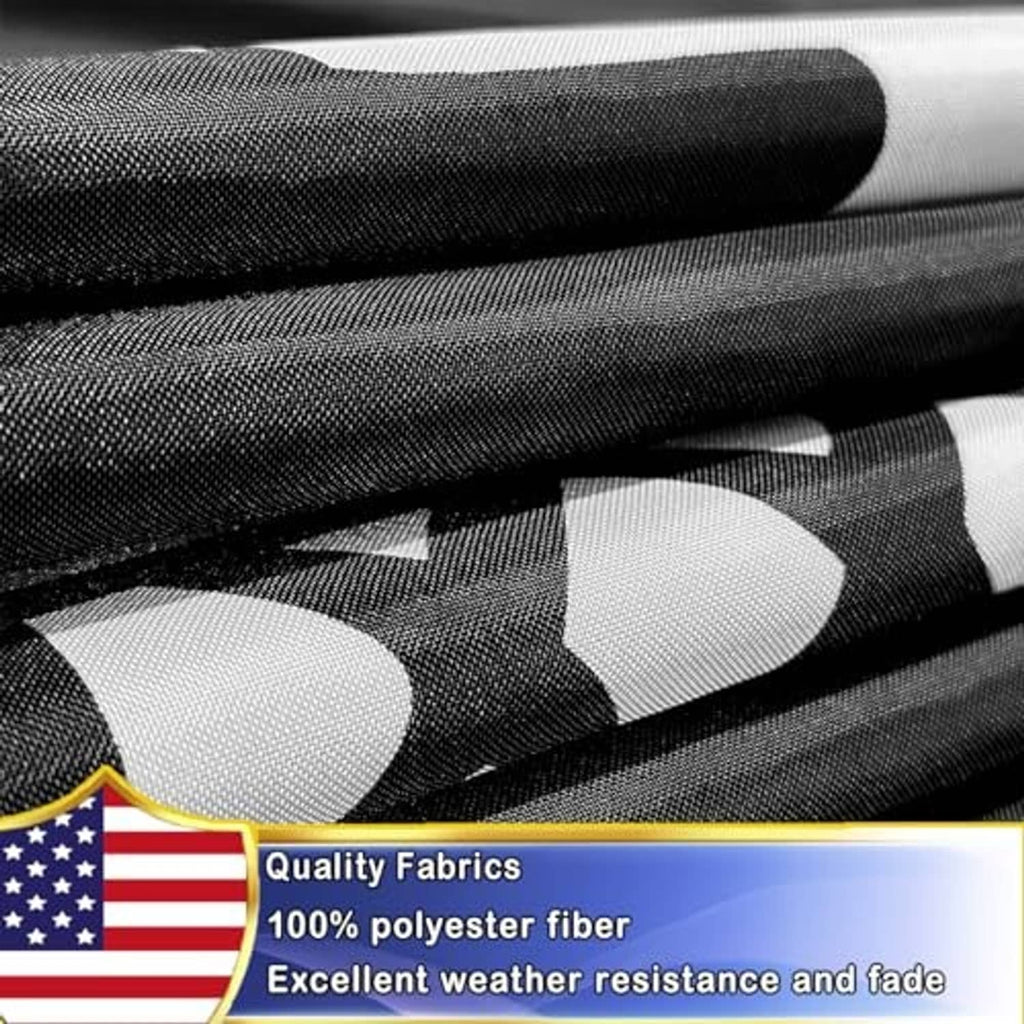 Black and white polyester flag fabric close-up with POW-MIA emblem graphic edge