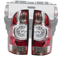 Driver-side tail light assembly, red and clear lenses with chrome reflector