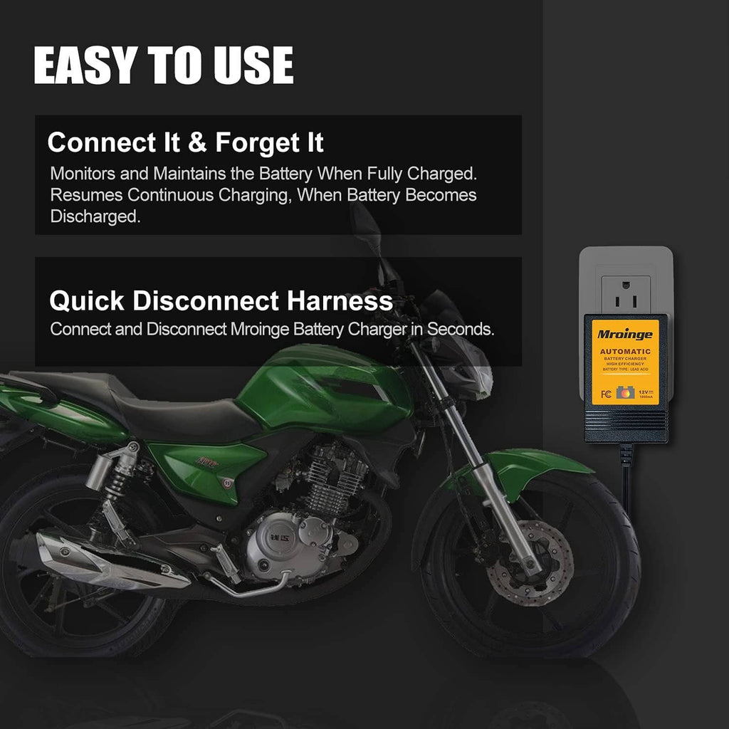 Automatic battery charger with quick-disconnect harness, shown connected on a motorcycle.