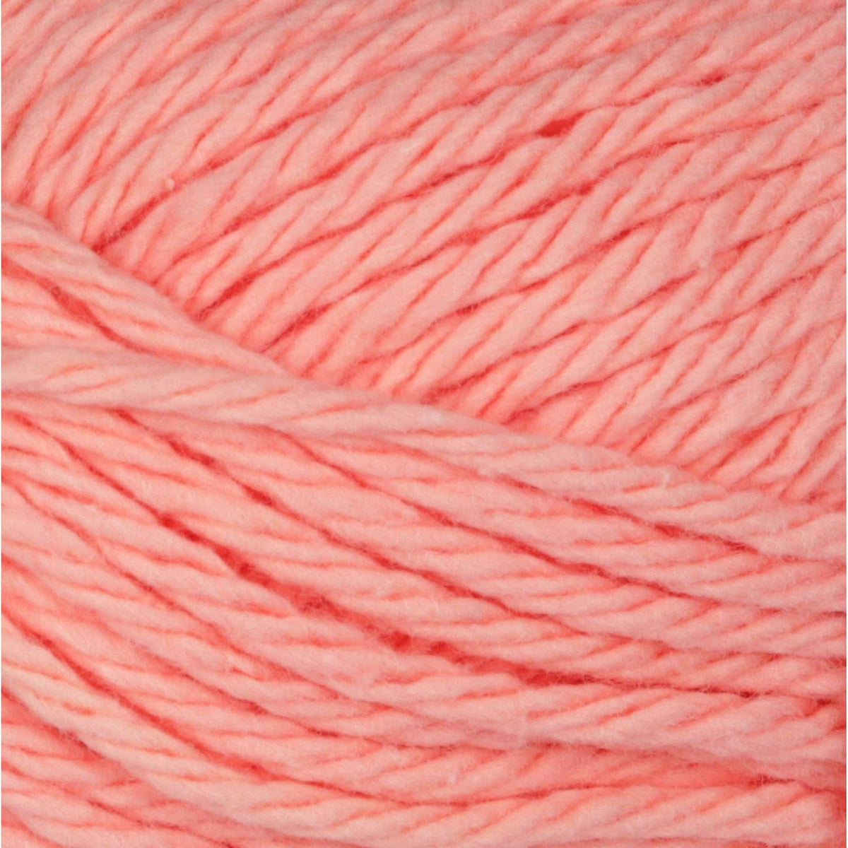 Coral rose yarn close-up with twisted strand texture