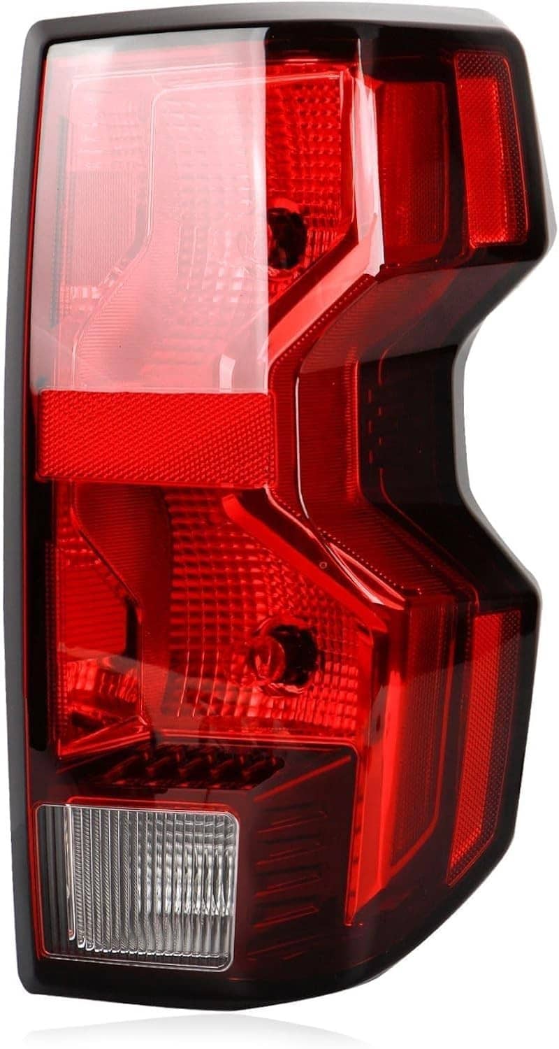 Right passenger LED tail light lens close-up with red sections and white lower reflector
