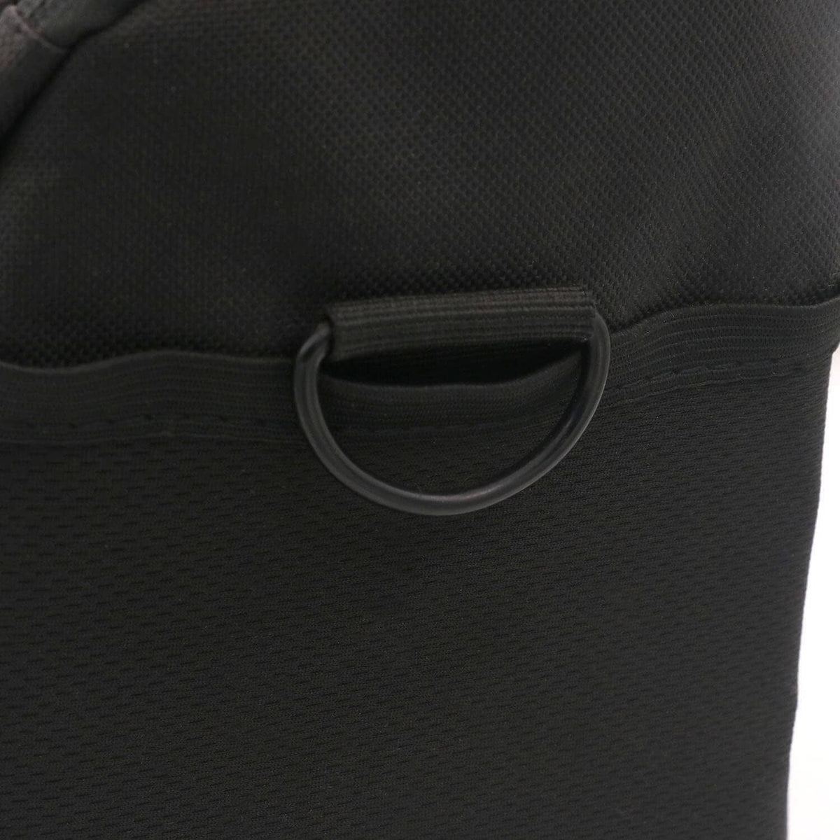 Black D-ring buckle stitched to fabric, U-shaped non-welded metal loop