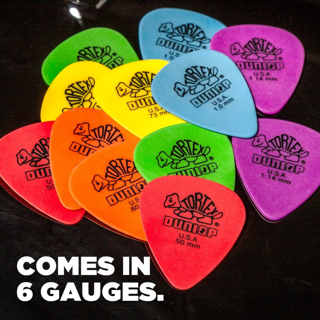 Mixed-color Dunlop Tortex guitar picks grouped together, showing U.S.A. logo marks.