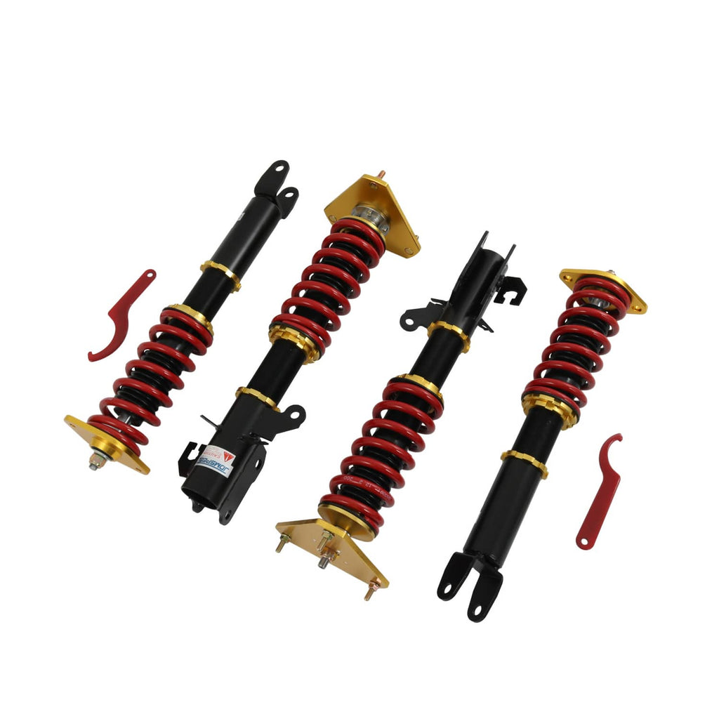 Coilover suspension kit with four shocks, black bodies and red coil springs with hardware