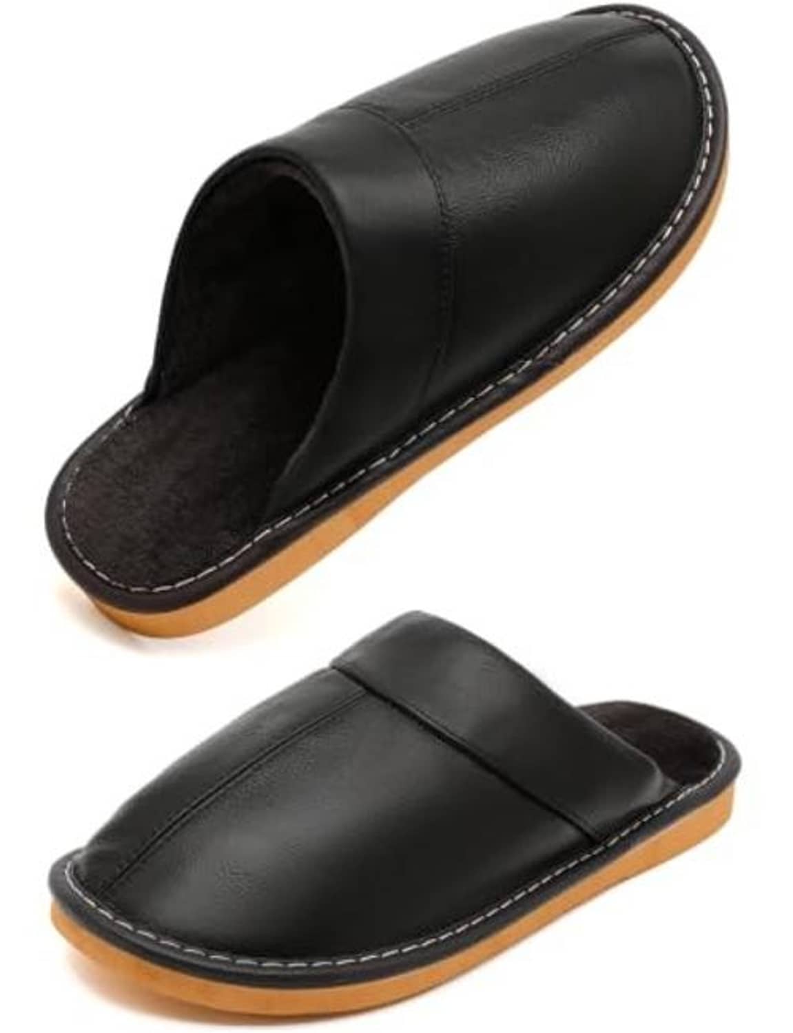 Pair of black leather slip-on slippers with fuzzy lining and tan rubber sole