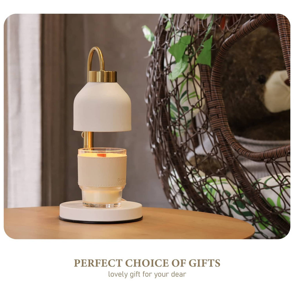 White candle warmer lamp with gold frame and illuminated warmer on tabletop
