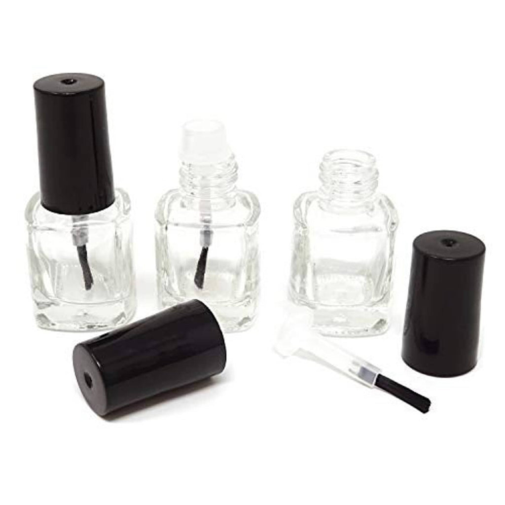 Set of empty clear nail polish glass bottles with black brush caps and inserts