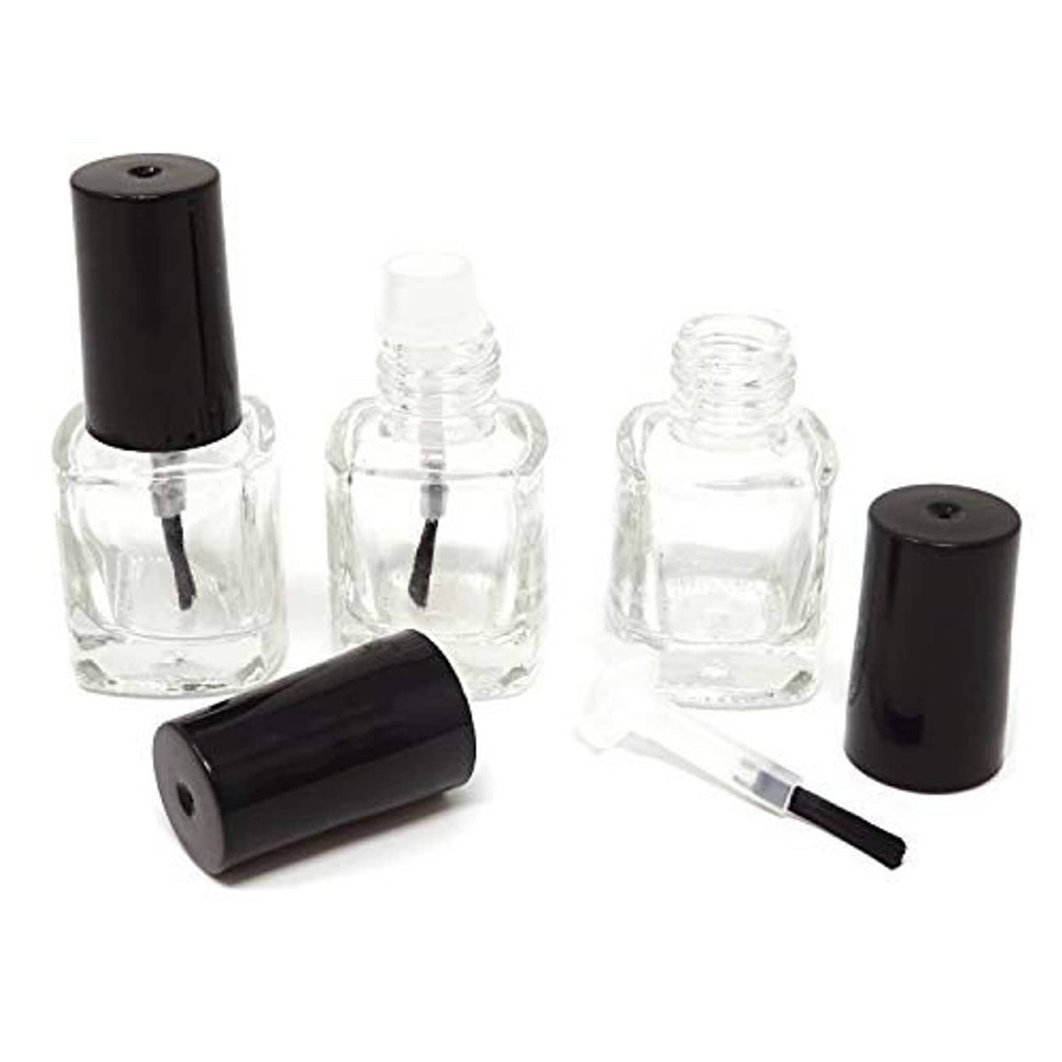 Set of empty clear nail polish glass bottles with black brush caps and inserts