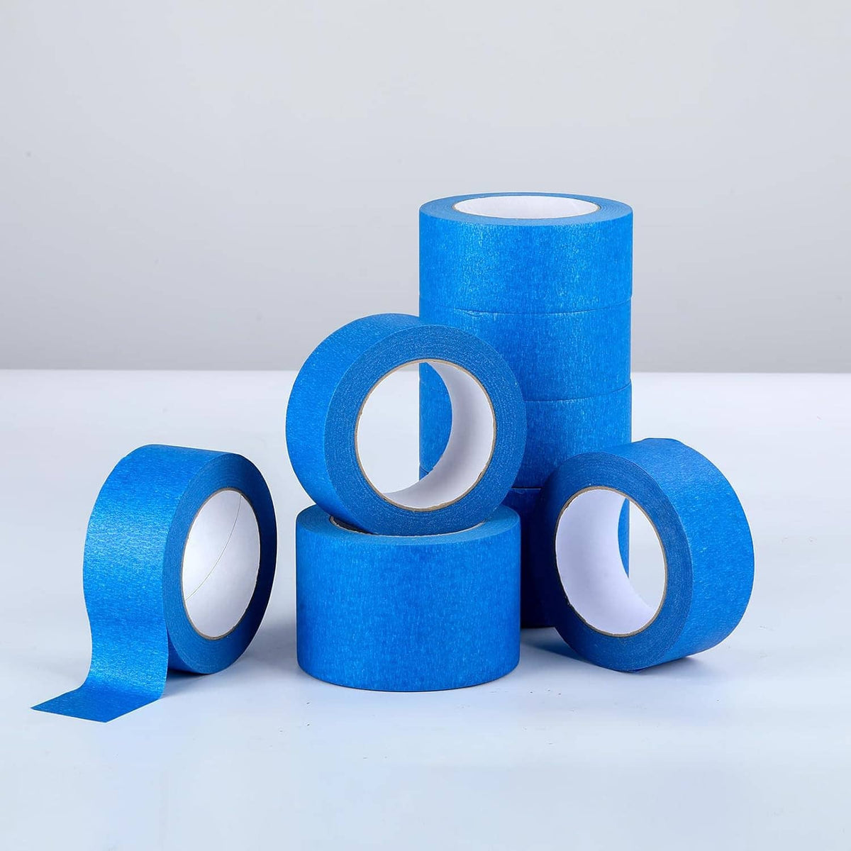Blue painters tape rolls stacked, wide masking tape for masking and protection