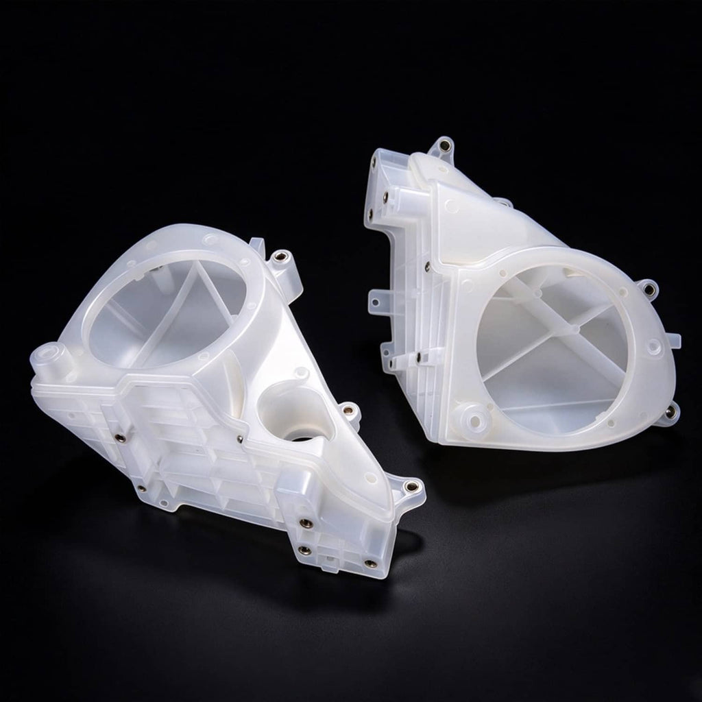 White inner fairing speaker cover housings with circular openings and mounting holes
