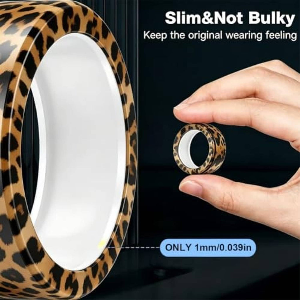 Slim cow print smart ring cover sleeve with smooth interior, shown held in hand.