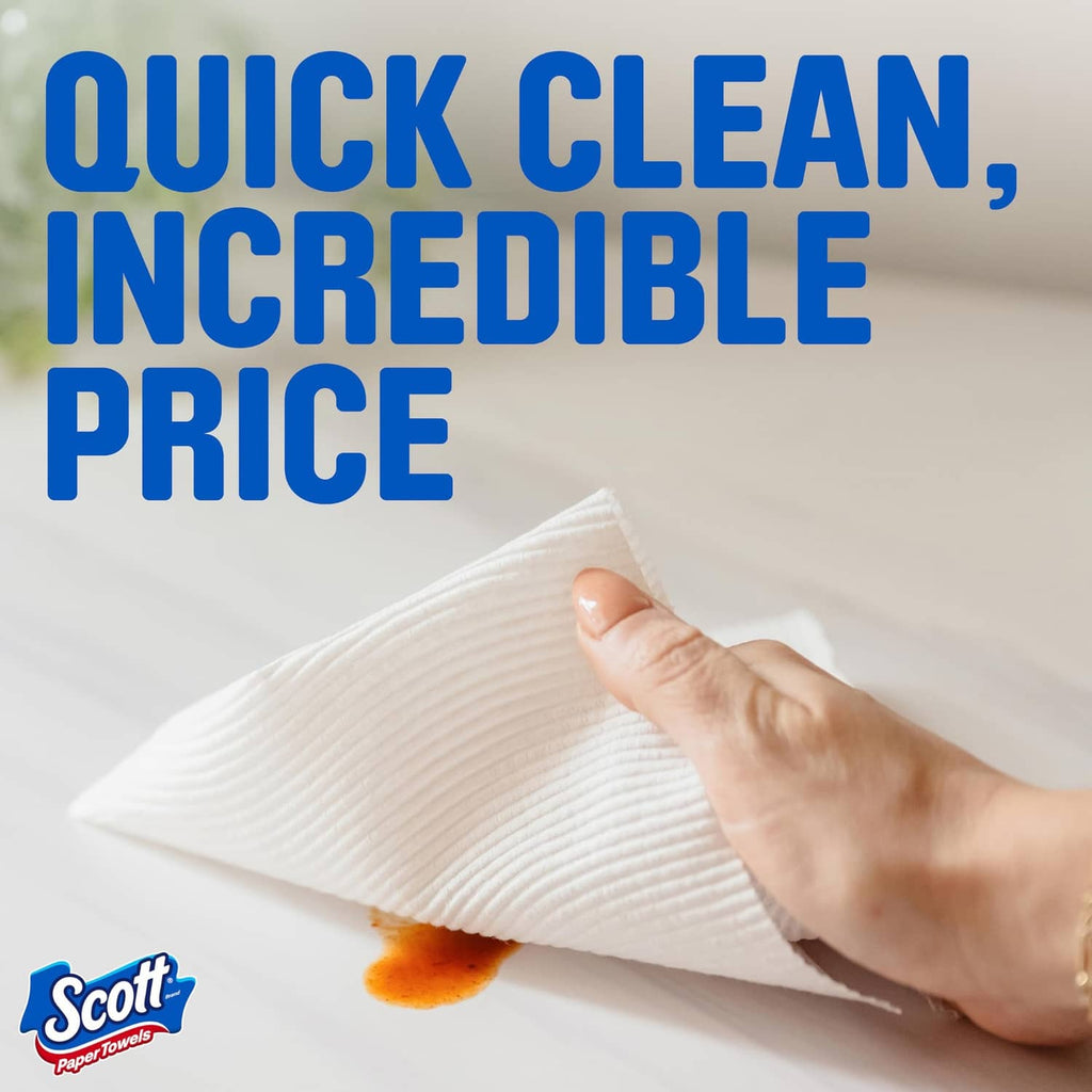 Hand wiping with a white Scott paper towel sheet; visible absorbent ridged surface.