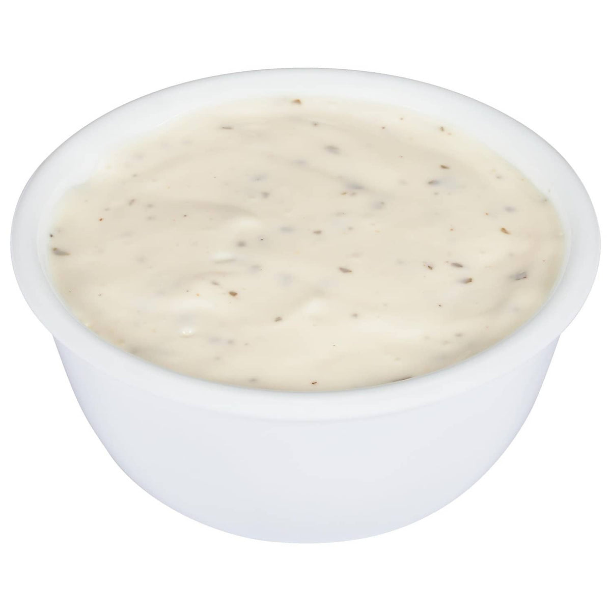 Small cup of creamy ranch dressing with visible seasoning specks