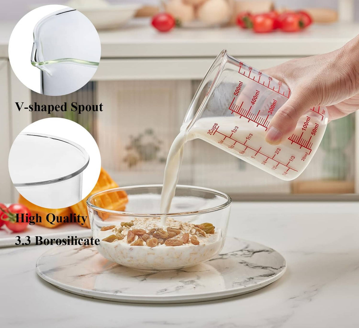 Clear glass measuring cup with V-shaped spout, red scale markings, being poured from 500 ml