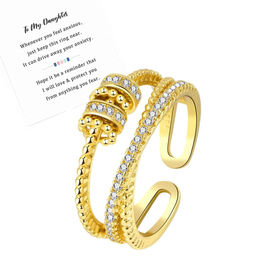 Gold-tone fidget ring with stacked domed rows and clear cubic zirconia stones