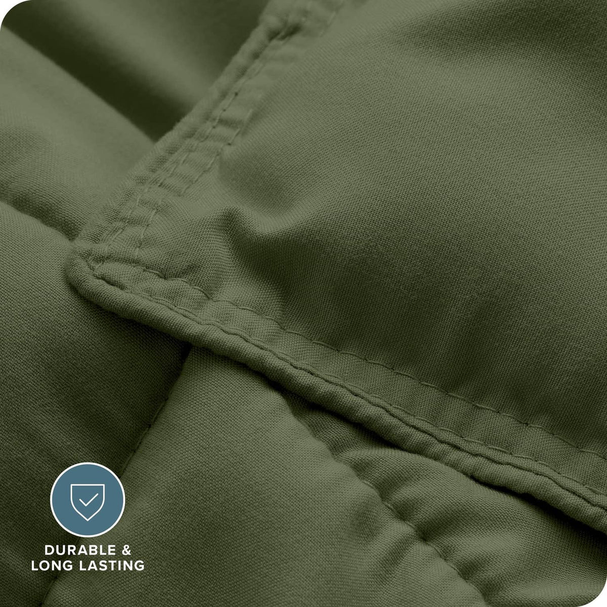 Cypress green down-alternative comforter fabric close-up with neat seam stitching