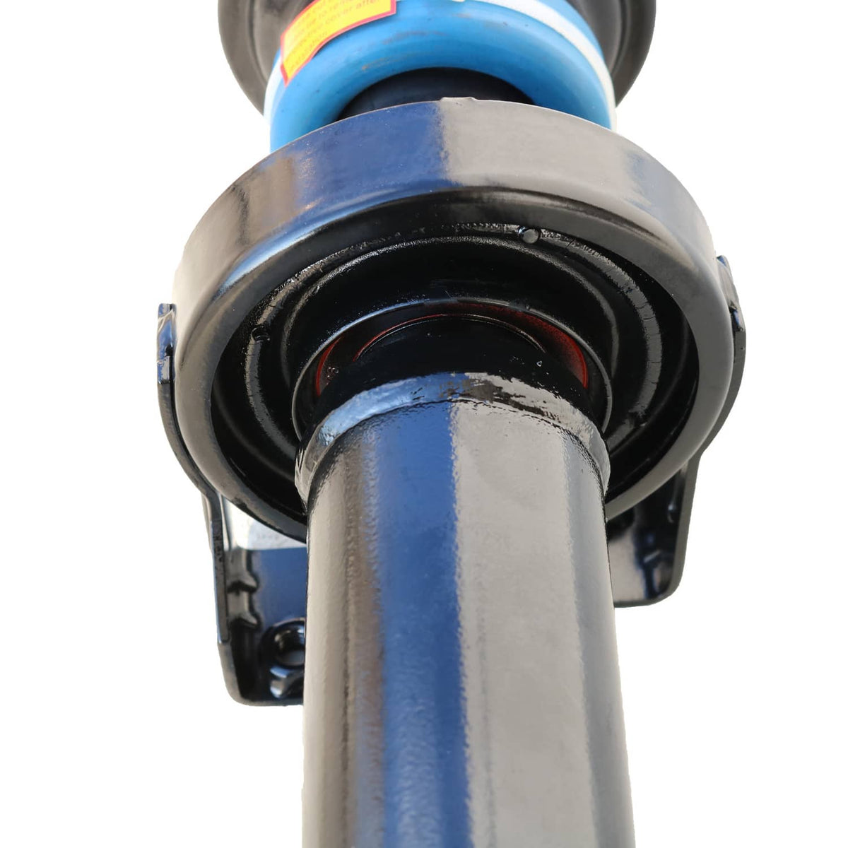 Drive shaft assembly cross area with black rubber boot and metal housing