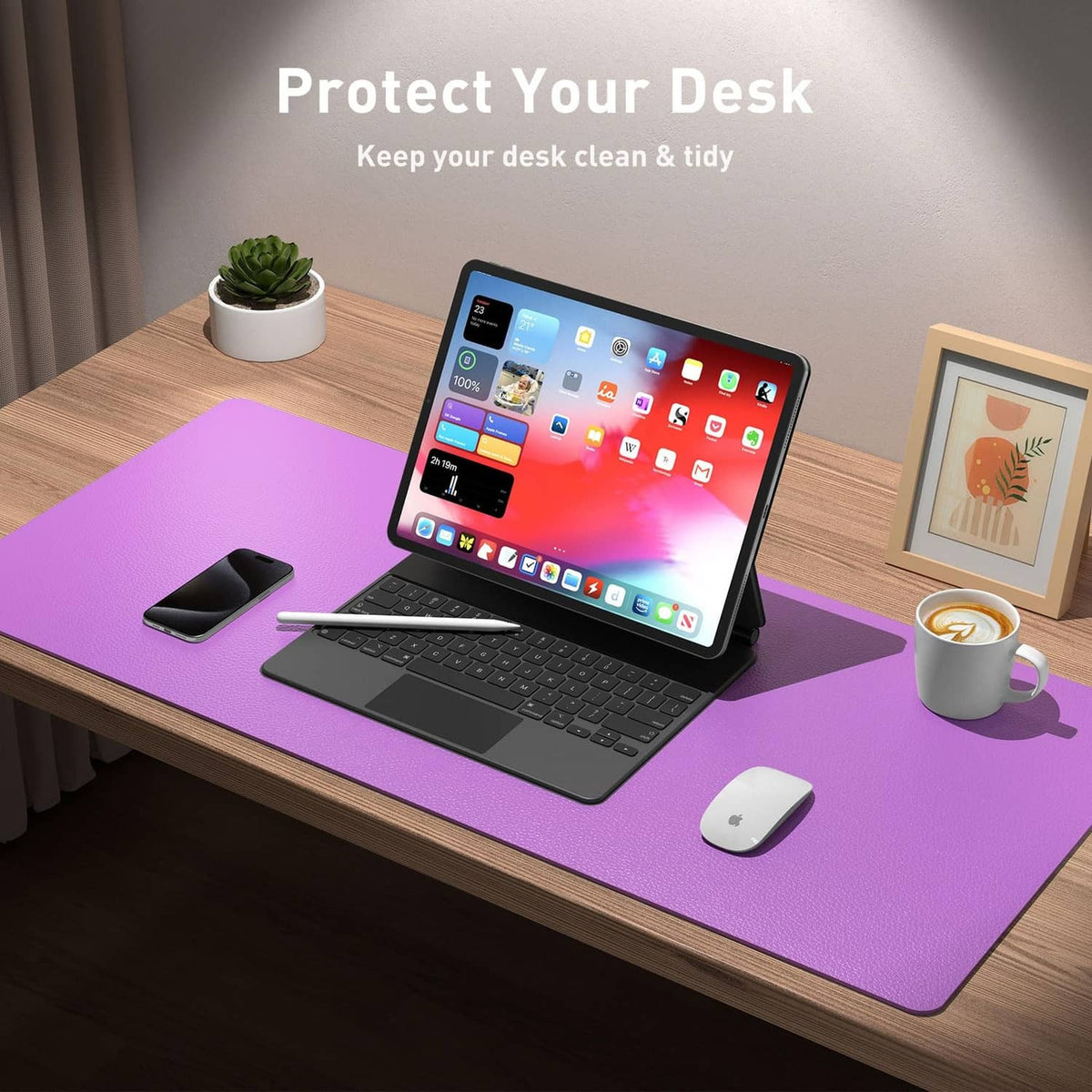 Iris violet desk pad on wooden desk under laptop and wireless mouse