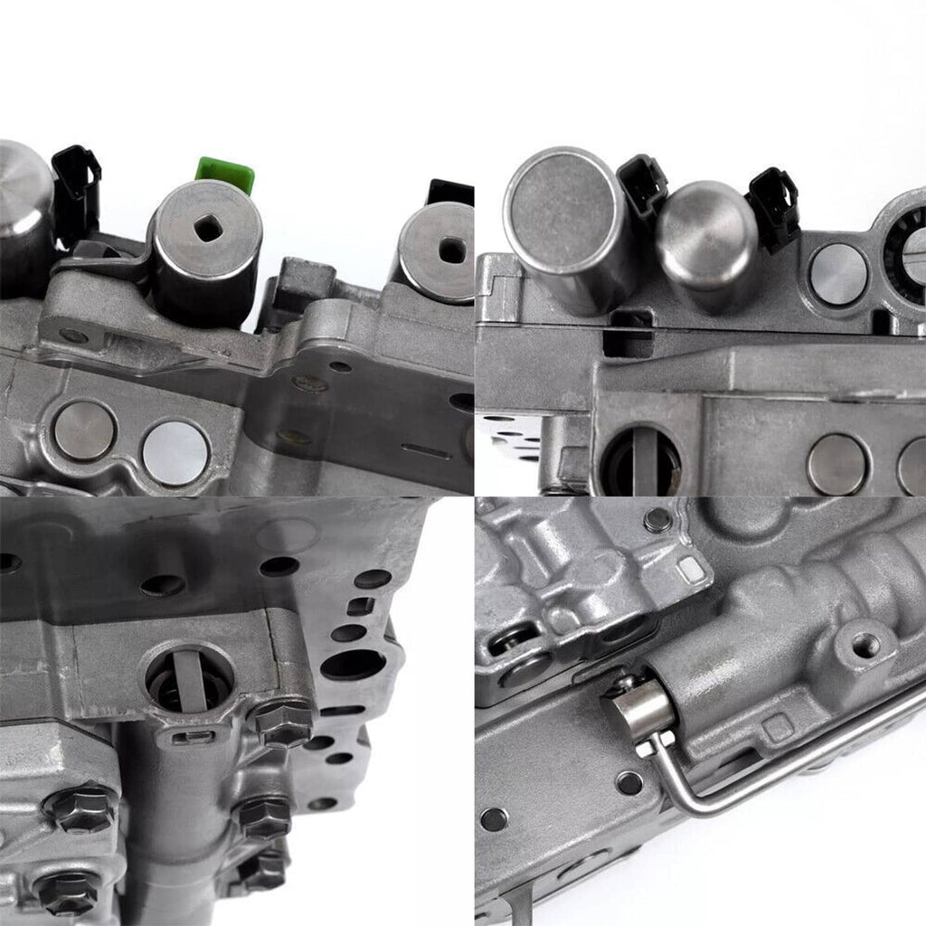 Transmission valve body close-up, silver-gray housing with black caps and green connector