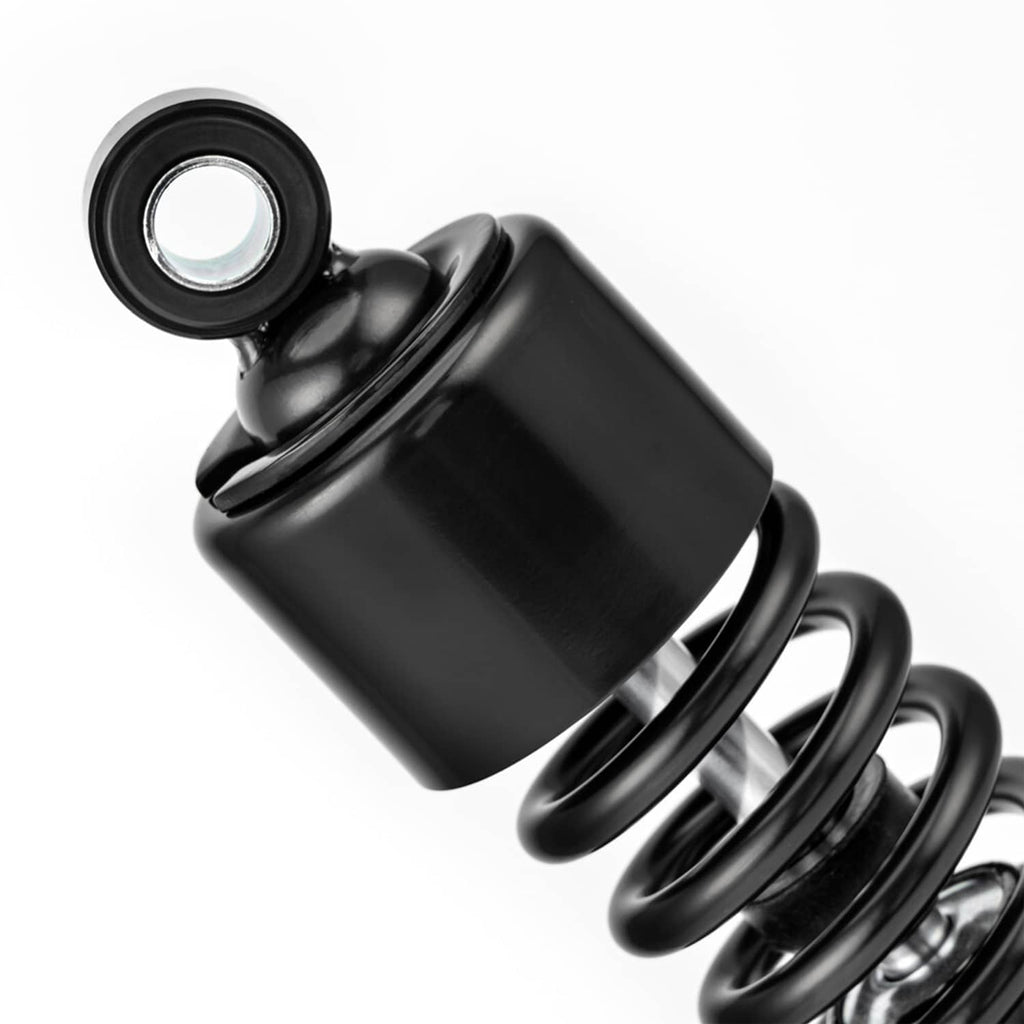 Close-up of black adjustable shock absorber body and top mounting bushing
