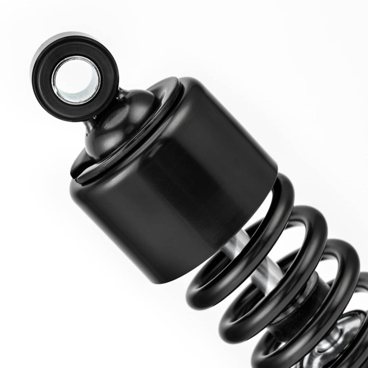 Close-up of black adjustable shock absorber body and top mounting bushing