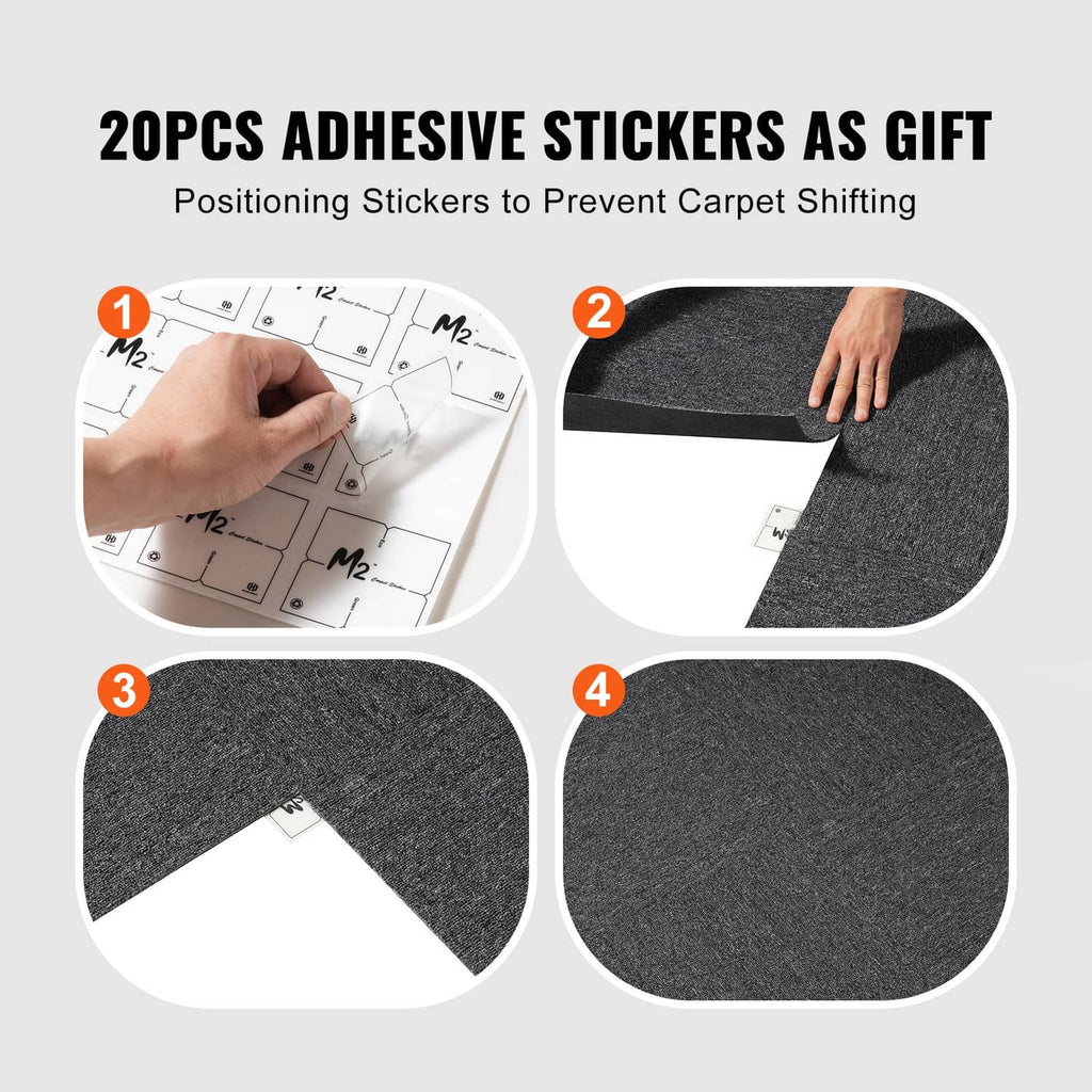 Dark gray carpet tile squares with white positioning stickers to help prevent shifting