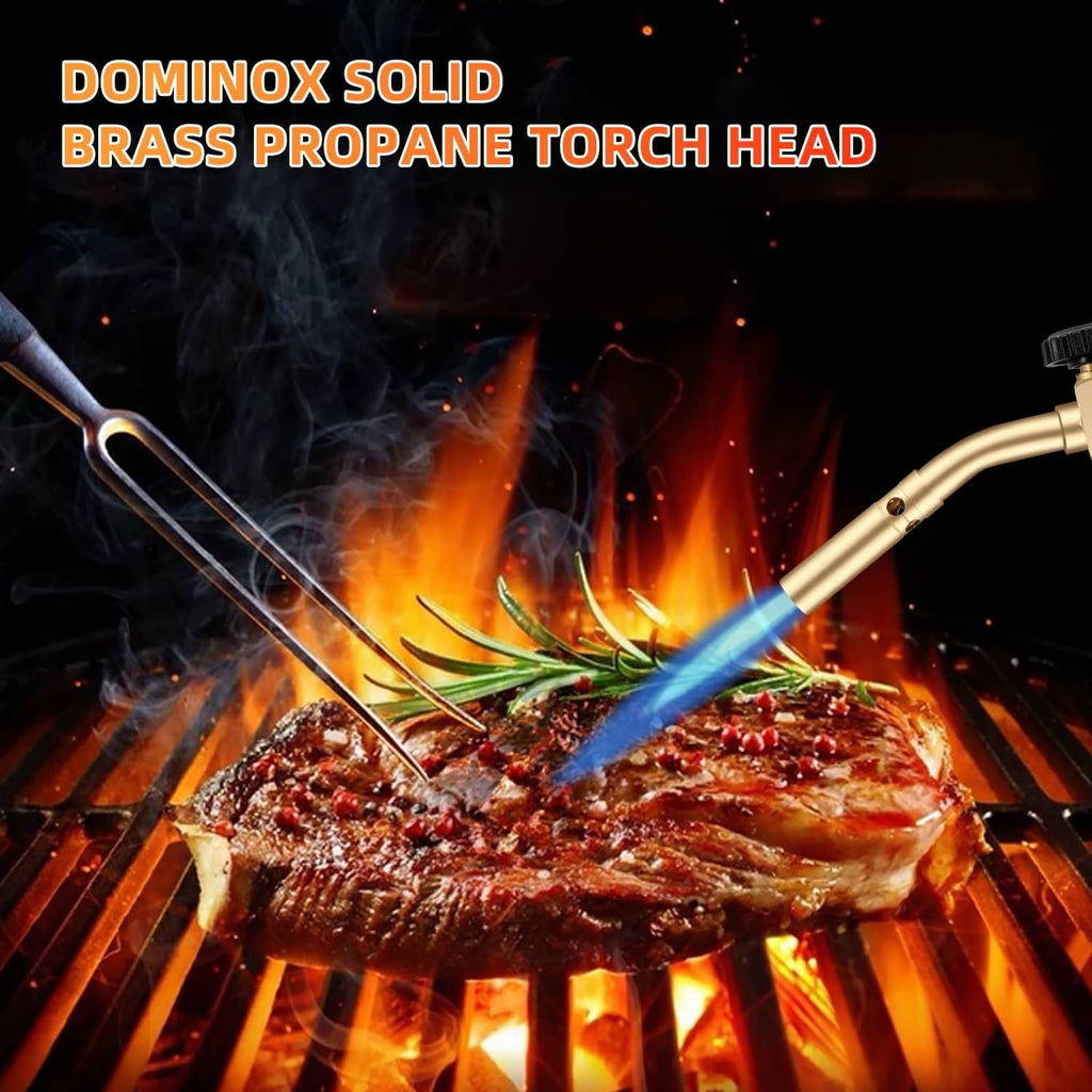 Solid brass propane torch head producing blue flame over grilled meat