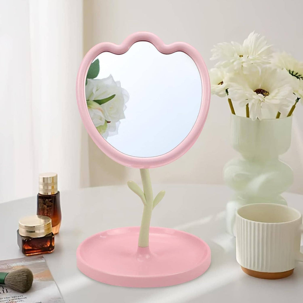 Pink flower-shaped tabletop vanity mirror on circular base, adjustable angle stand