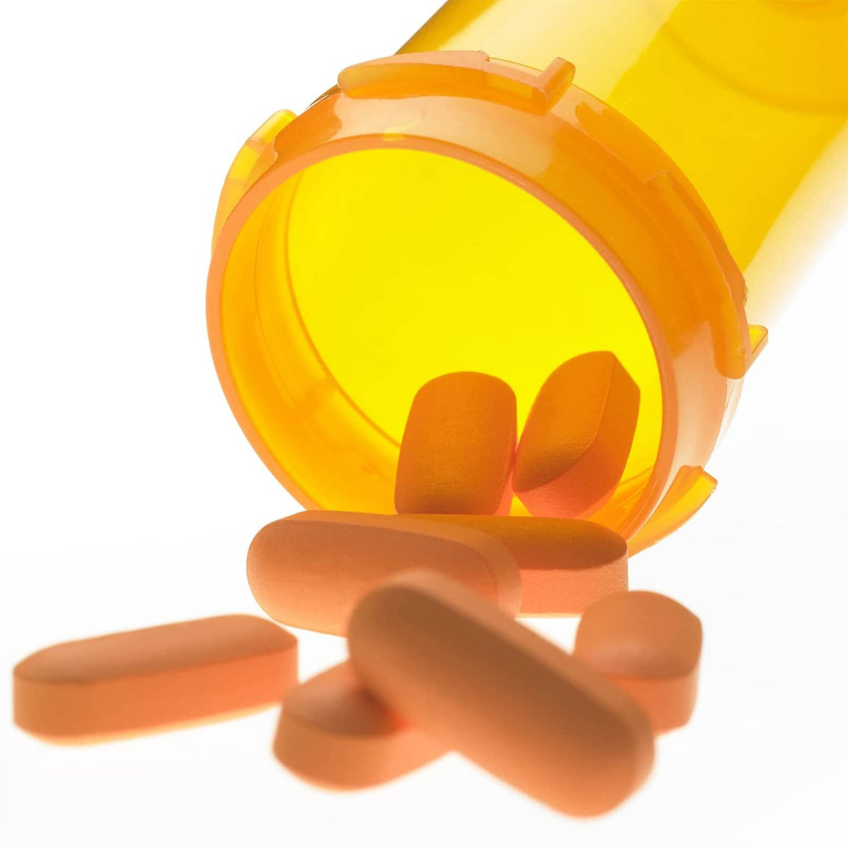 Orange pill bottle with white child-resistant cap showing locking tabs