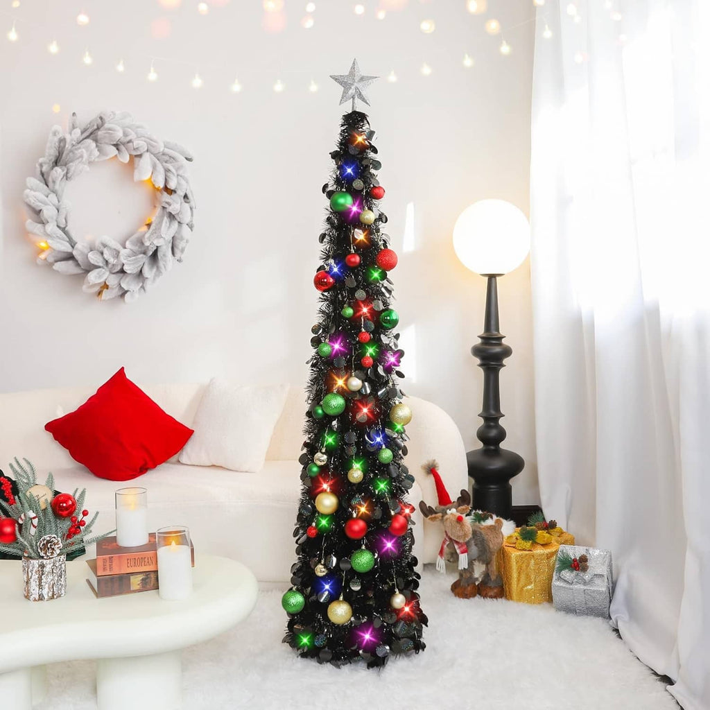 Black tinsel Christmas tree with star topper, multicolor lights, and hanging ball ornaments