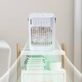 White portable air cooler with front grille and top control panel, compact fan unit