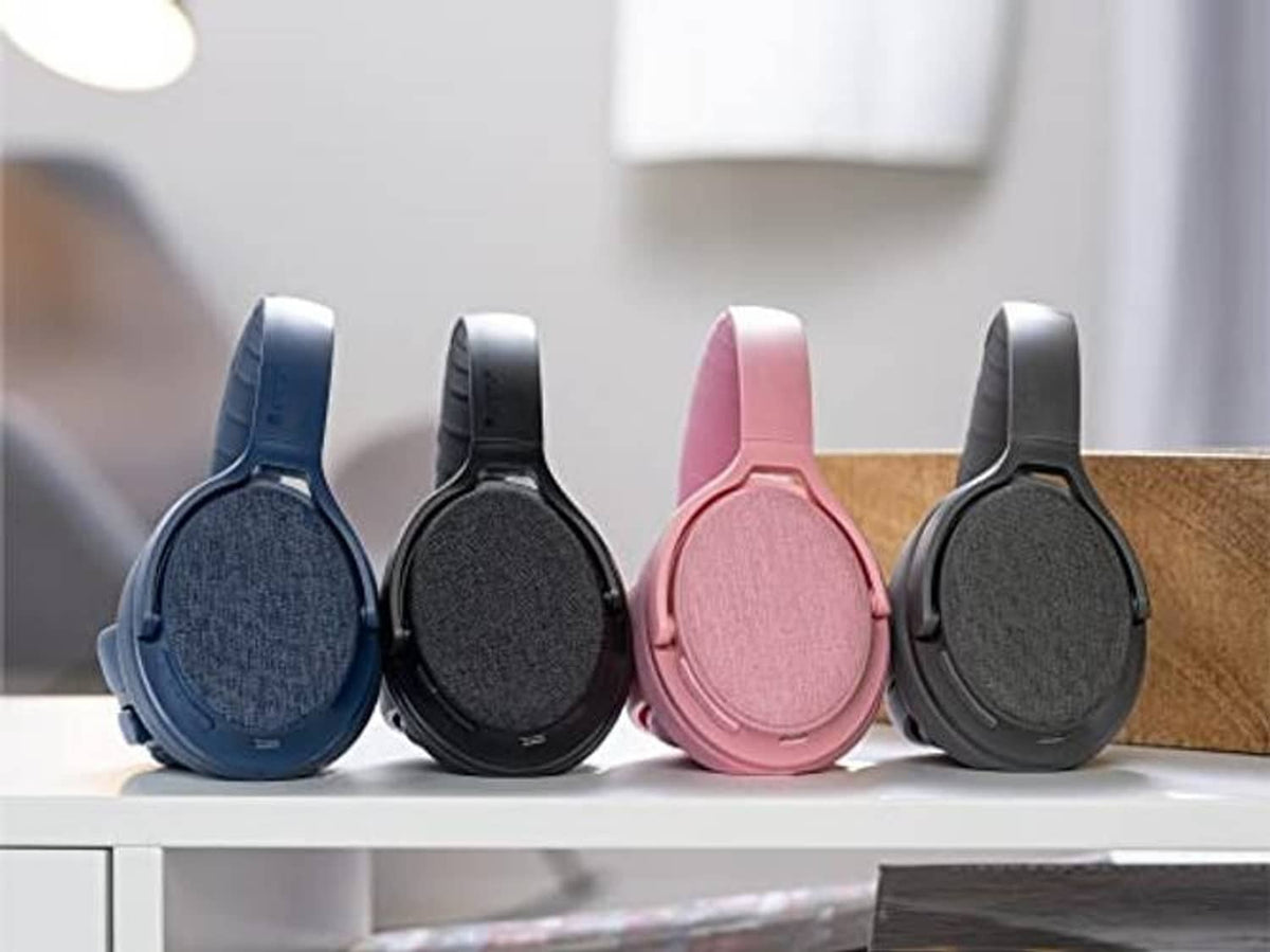 Over-ear headphones in blue, black, pink, and gray displayed