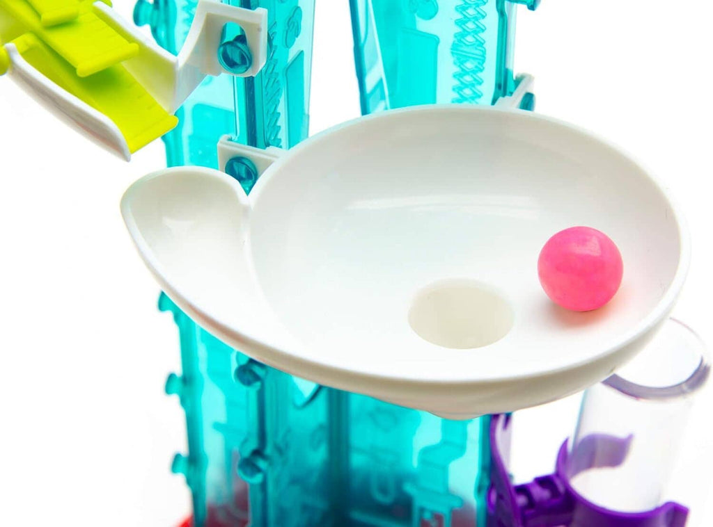 White upper chute on gumball machine holding a single pink ball.