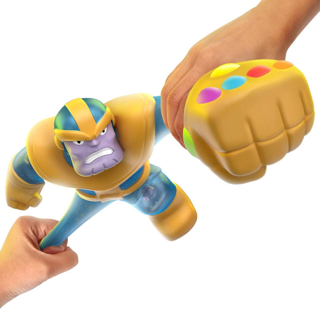 Thanos stretchy figure with blue arms and yellow gloves, held while stretched forward