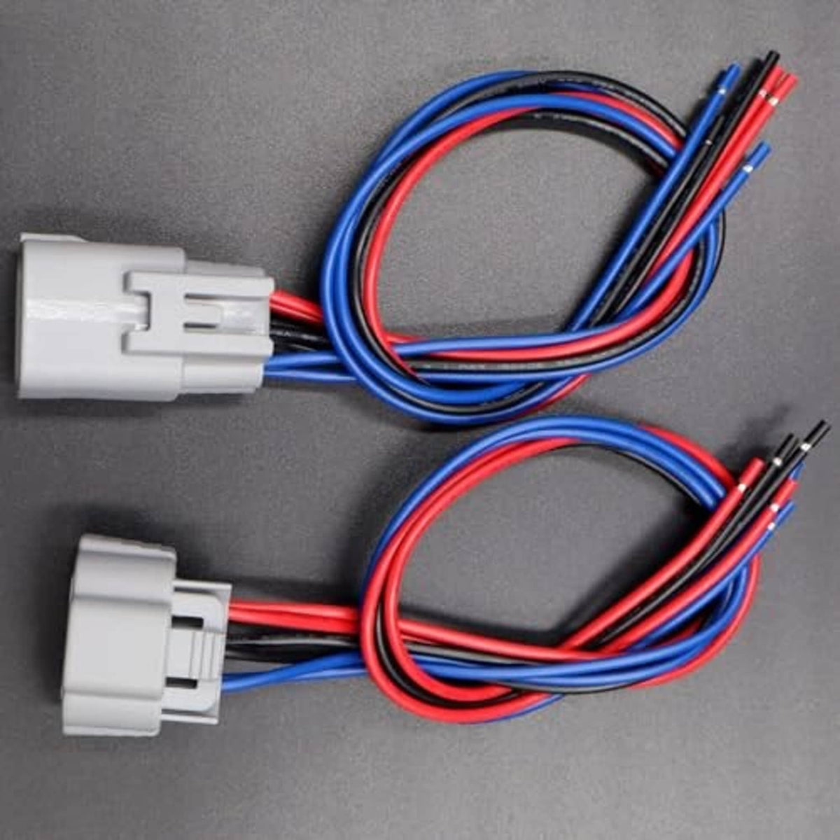 Pair of 6-pin headlight connector harnesses with gray clips and red/blue wires