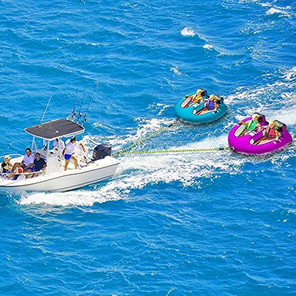 Yellow braided boat tow rope stretching from a boat toward a rider on the water