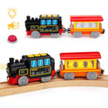Battery-powered black and red locomotive with blue window panels and yellow roof lights