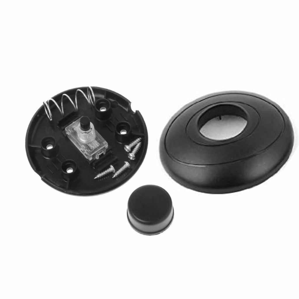 Black round foot pedal lamp switch with removable base plate and small push button.