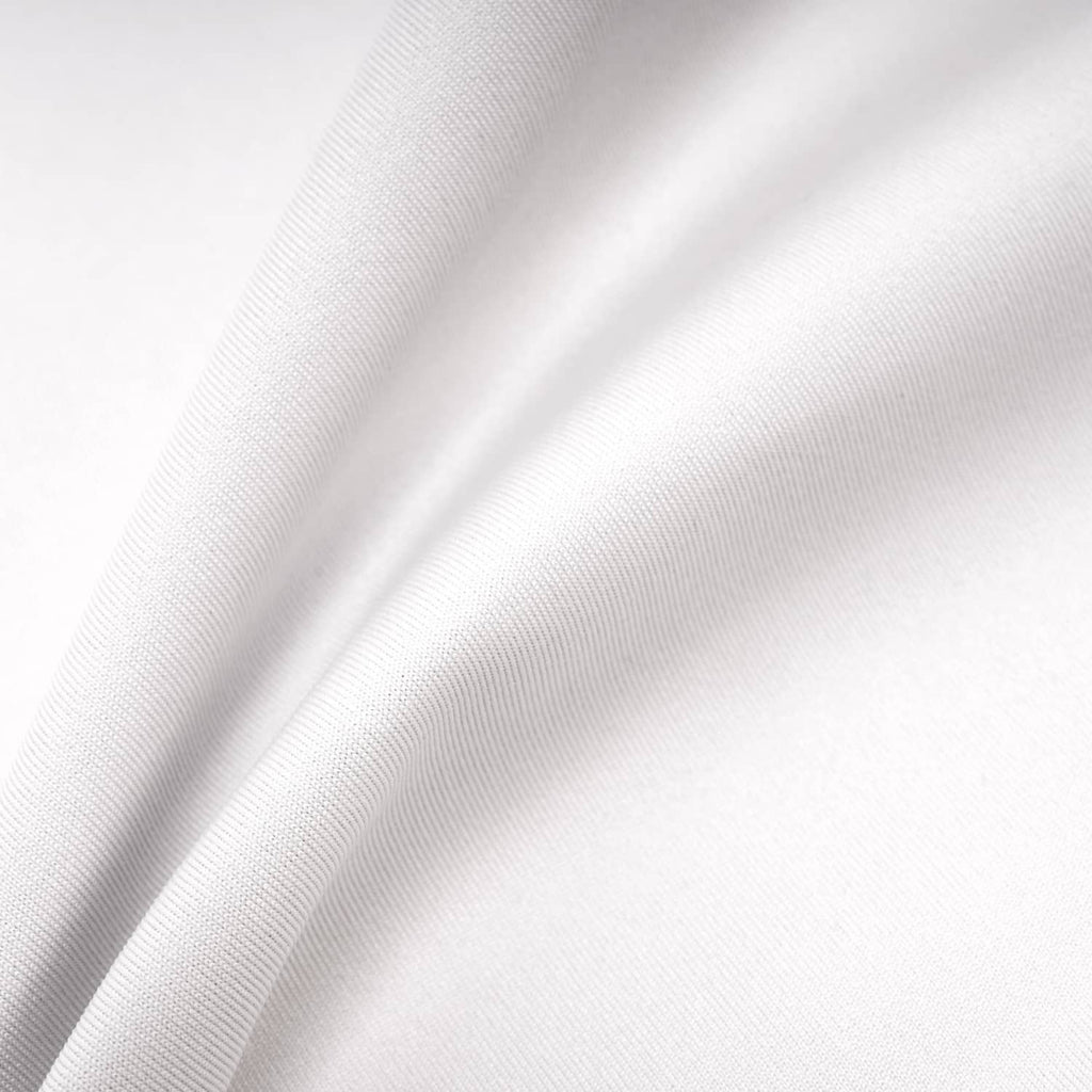 White fabric material close-up, woven texture with visible folds